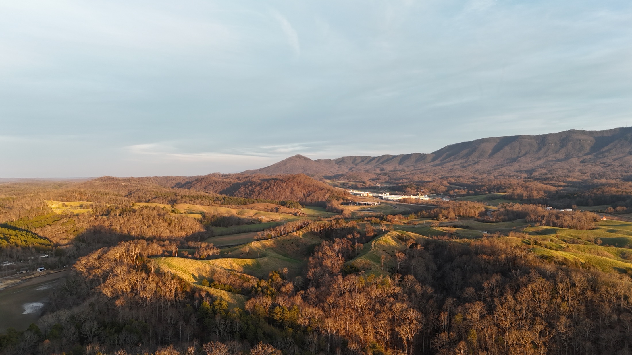 Golden aerial view of East Tennessee ridges near the Smokies